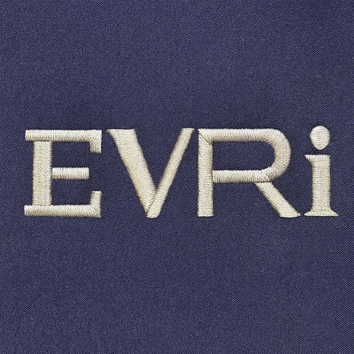 Embroidered 'EVRi' logo on a dark blue fabric background