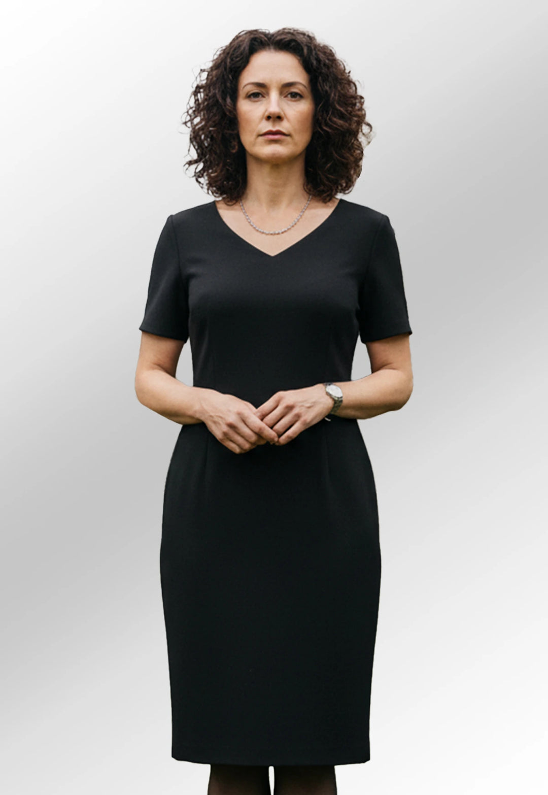 Clip of Model Wearing the Corinthia  V-Neck Dress 2246 in Black