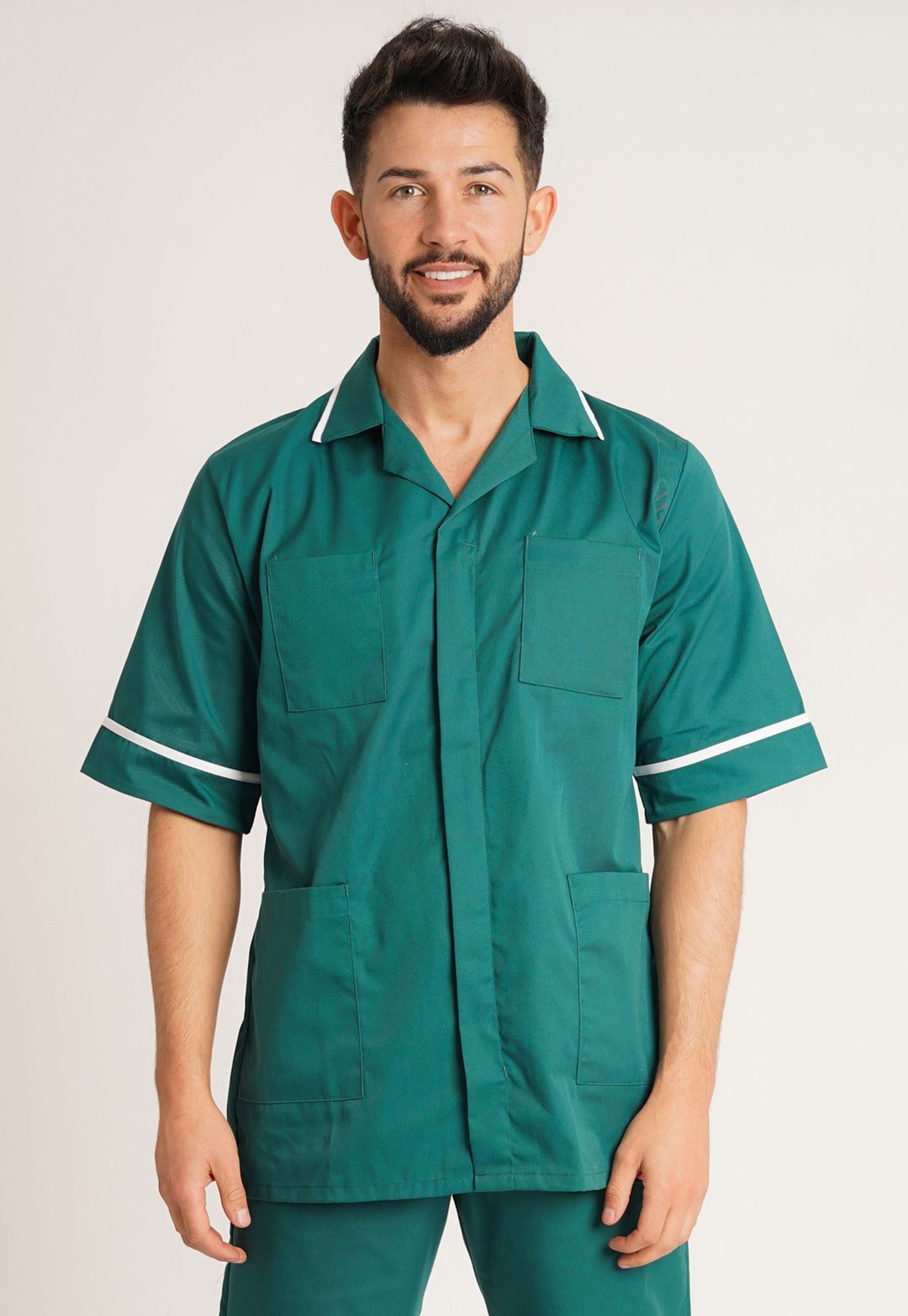 Model Wearing the Men's Calm Healthcare Tunic NCMT in Bottle Green/White Trim