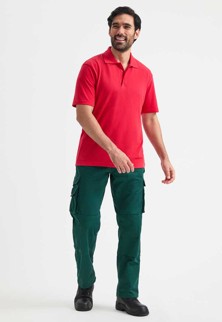 full length front view of model wearing uneek active polo in red