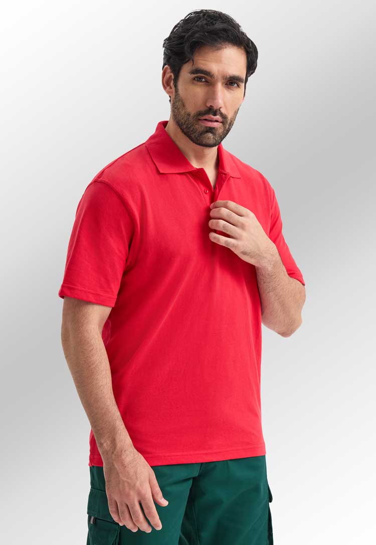 model wearing uneek active polo in red