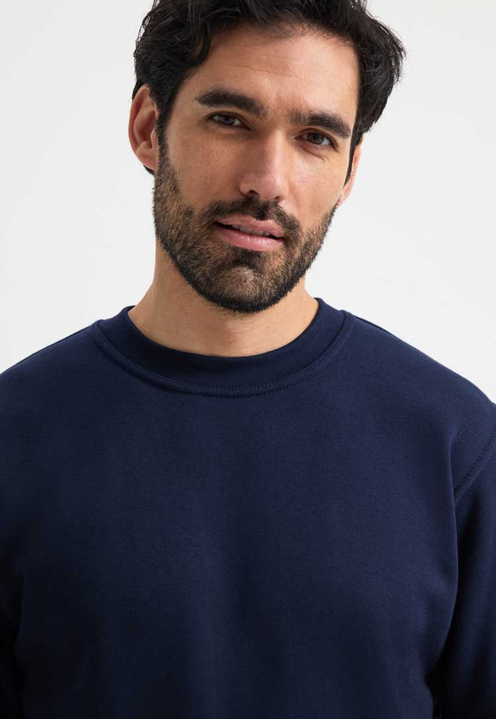 close up model wearing Premium Sweatshirt in navy blue