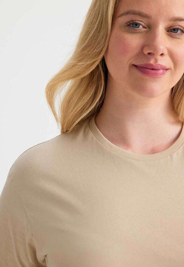 close up model wearing Classic T-Shirt in beige