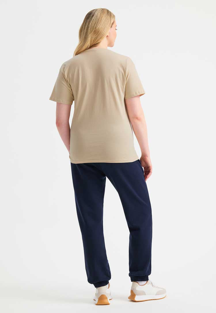 back view full length model wearing Classic T-Shirt in beige