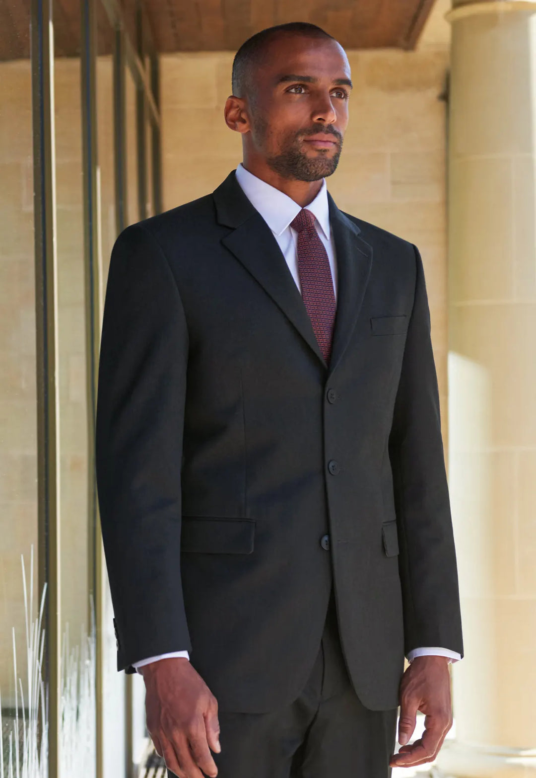 Model wearing the Brook Taverner Alpha Jacket in charcoal