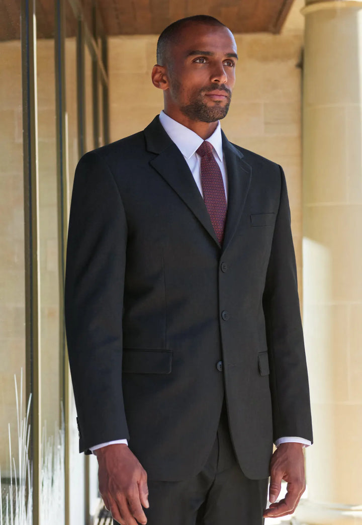 Model wearing the Brook Taverner Alpha Jacket in charcoal