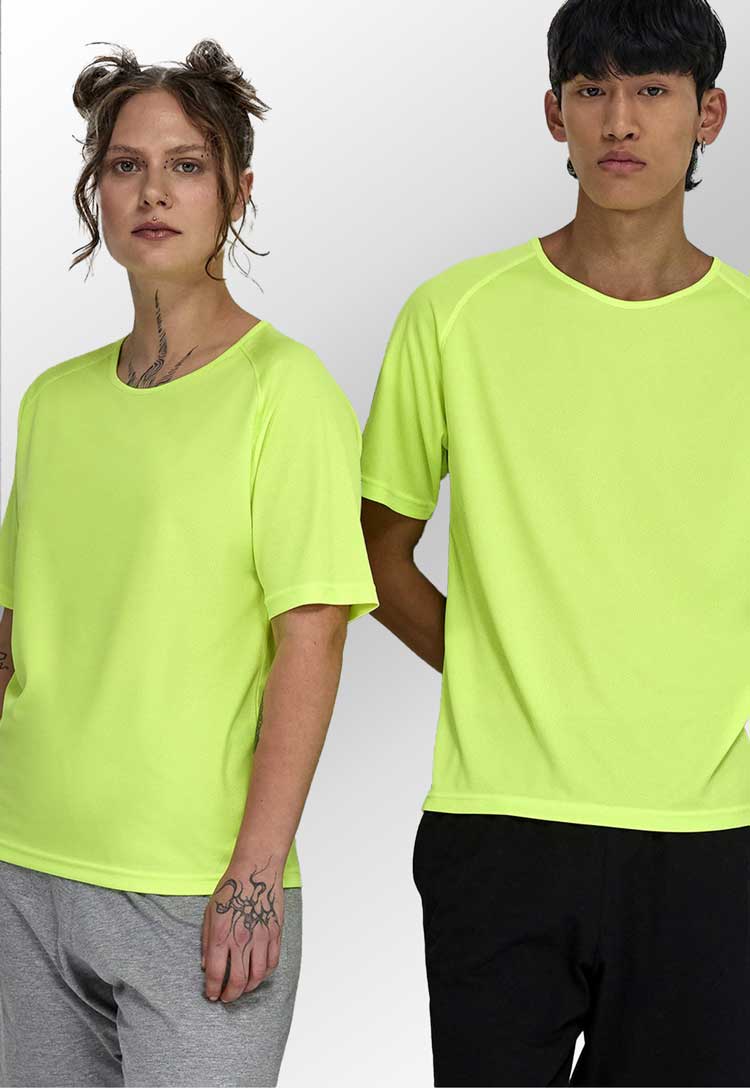 Models wearing B&C Active Tee BA040 in yellow