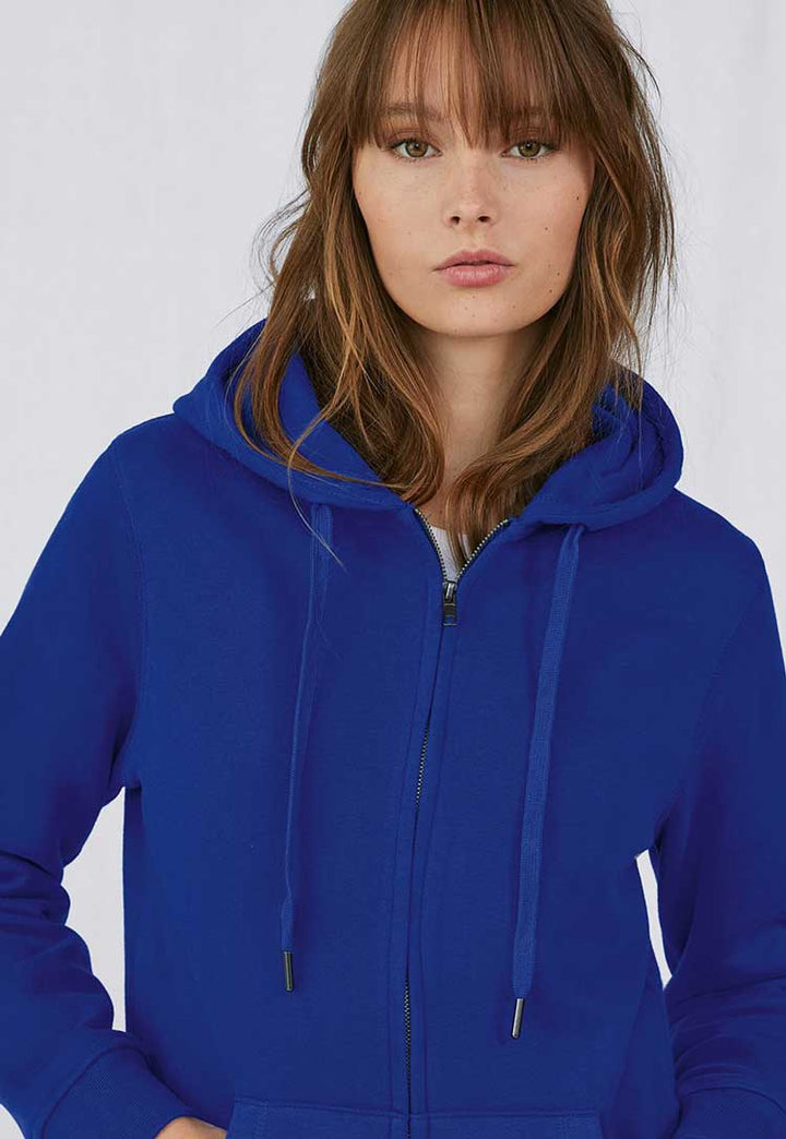 model wearing B&C Queen Zipped Hooded Sweatshirt B012F in royal