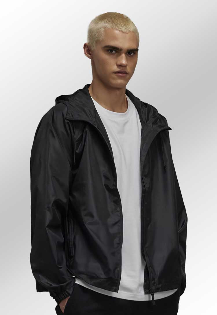 Model wearing B&C #Reset Unisex Windbreaker Jacket BA511