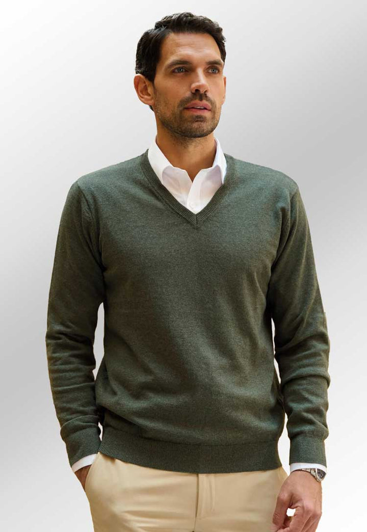 model wearing Berlin Marino Wool V-Neck Jumper 4566 in moss