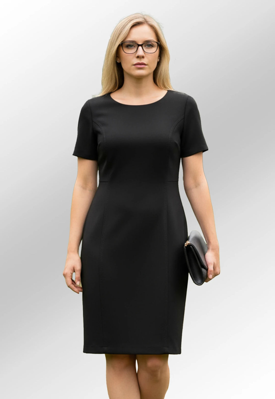 Woman wearing Brook Taverner black shift funeral dress