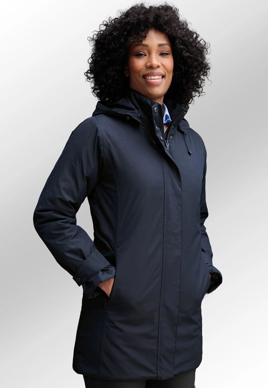 Model wearing the Brook Taverner Hobbs Padded Raincoat in Navy