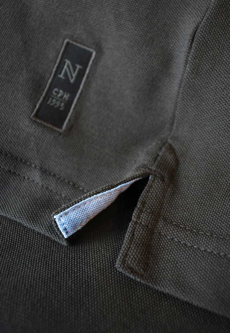 Nimbus Logo and Side Slit Detail of Carlington Deluxe Long Sleeve Polo NB71M