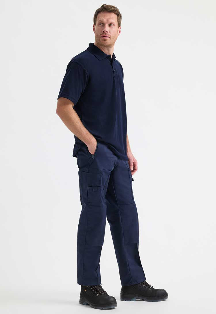 full length model wearing classic polo from uneek in navy