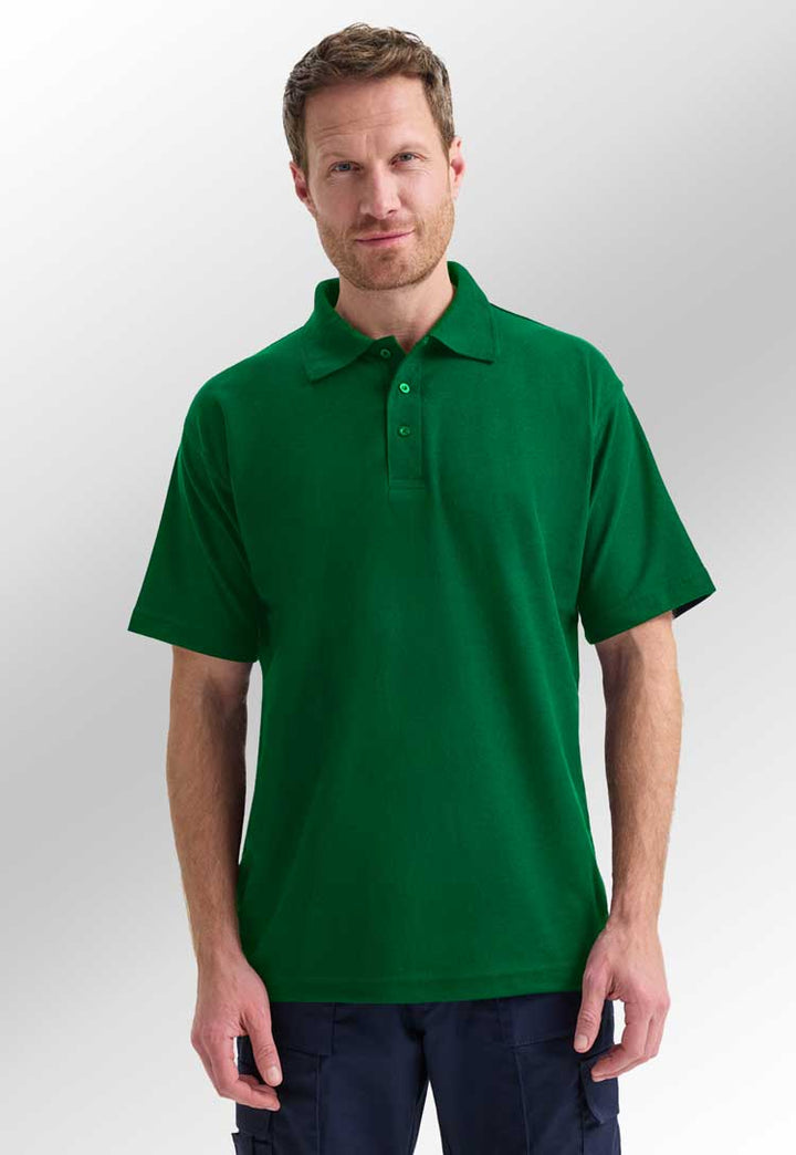 model wearing classic polo from uneek in kelly green