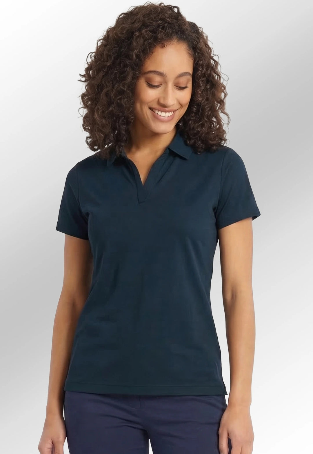 Model wearing the Women’s Clearwater Quick-Dry Performance Polo NB86F in Navy