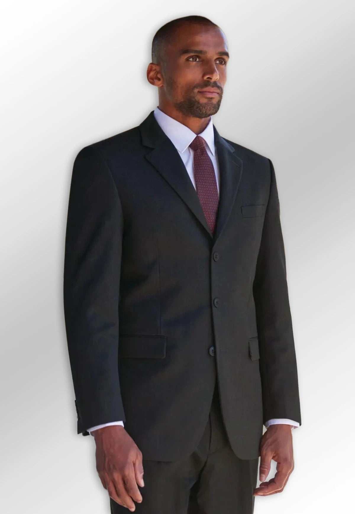 Male model wearing a suit jacket and trousers from the Brook Taverner Concept Menswear Collection.