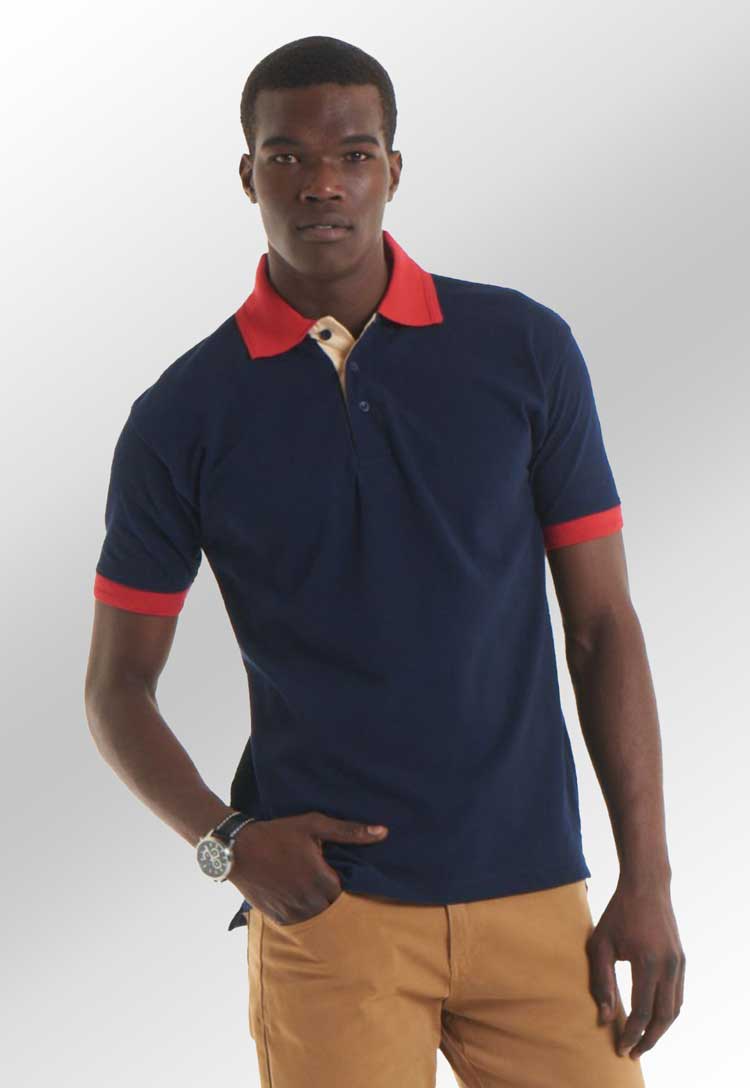 Model Wears UC107 Contrast Polo Shirt in Navy