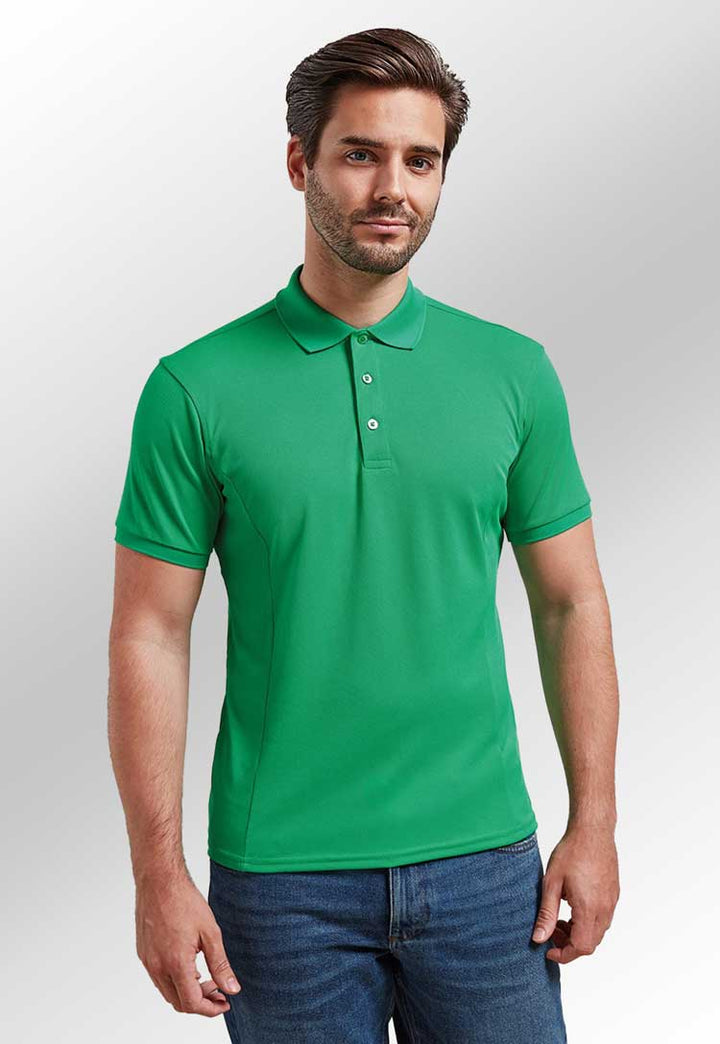 Model wearing Coolchecker® Plus Piqué Polo PR630 in kelly green