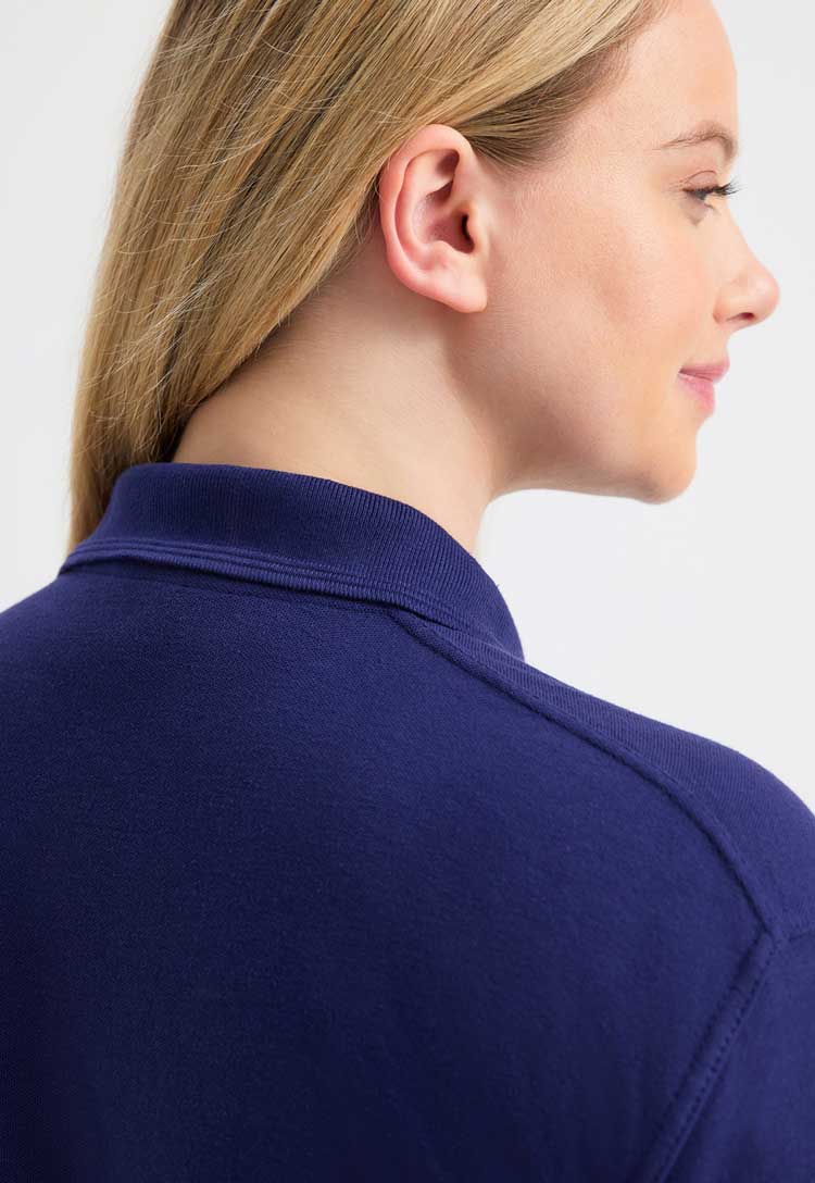 close up back view of model wearing Deluxe Polo Shirt in navy