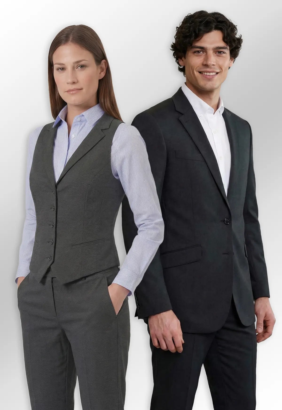 Man and woman in Brook Taverner Eclipse Collection formal business attire standing side by side