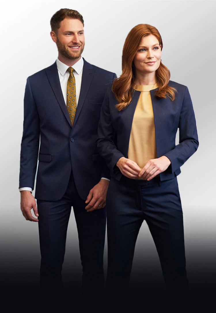 Man and woman in Brook Taverner Eclipse Collection formal business attire standing side by side