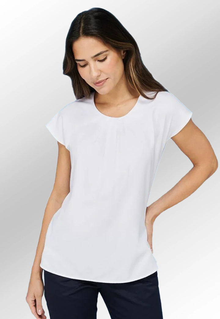 Model wearing the Henbury Women's Pleat Front Short Sleeve Blouse HB597 in White.