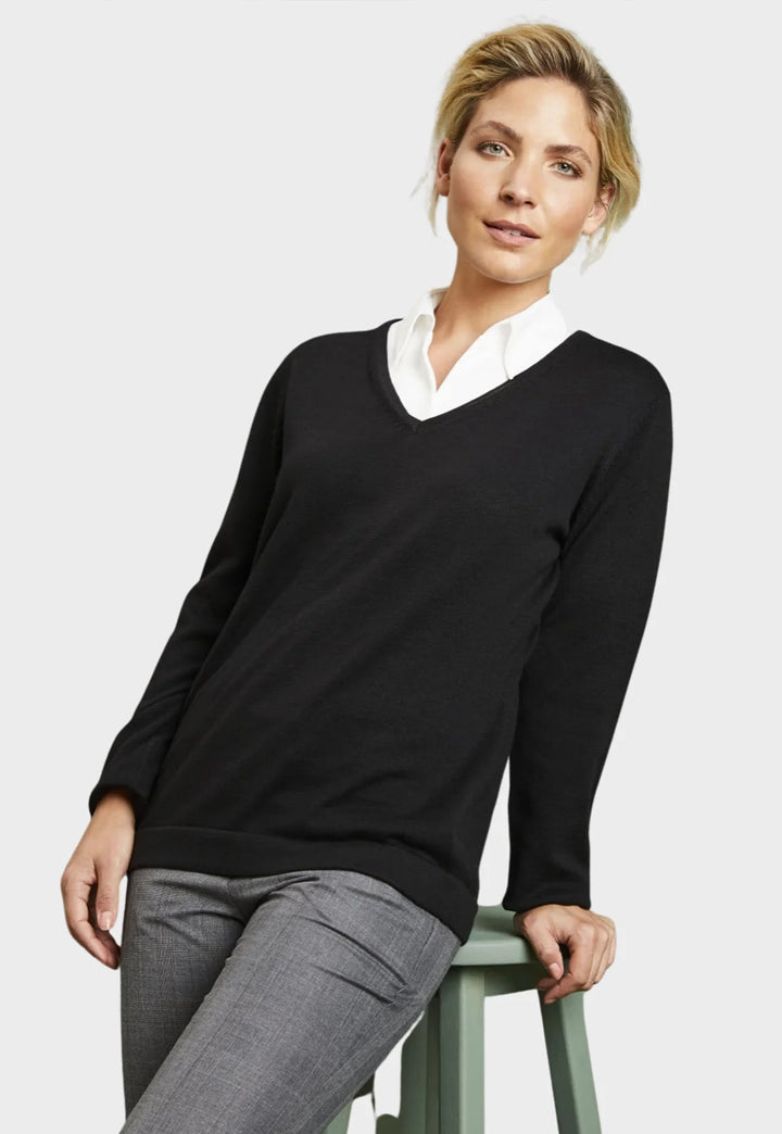 Model wearing the Henbury Women's 12 Gauge V Neck Jumper in Black.