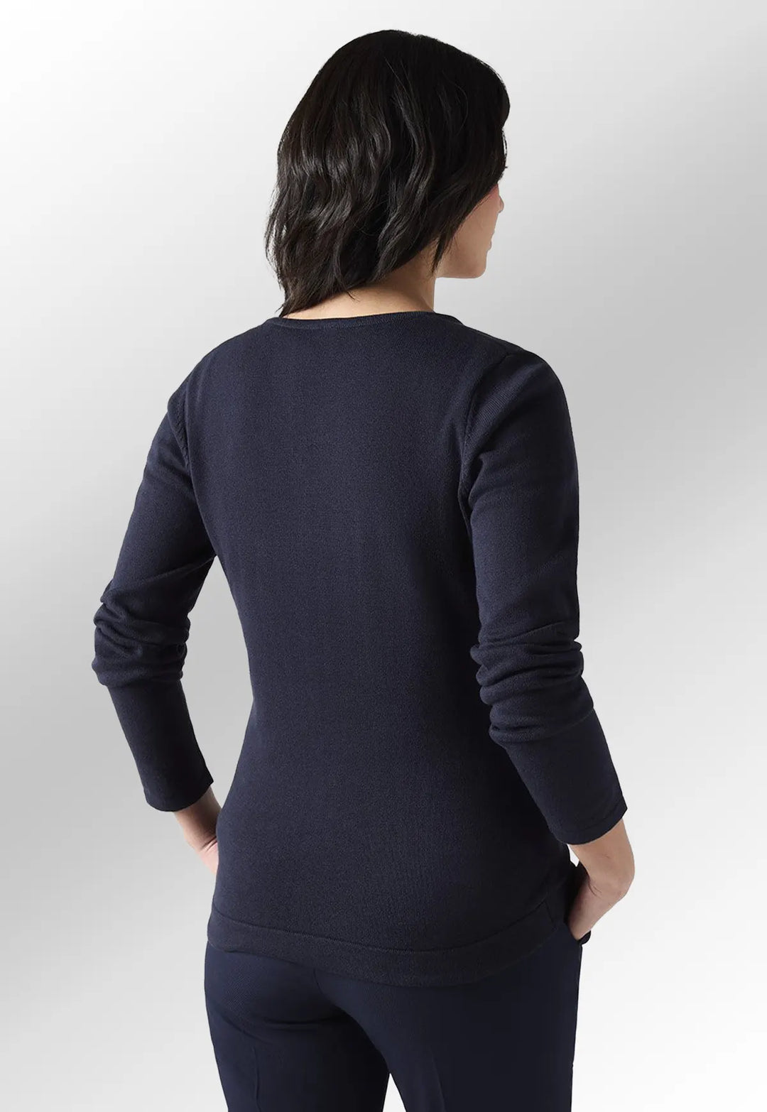 Rear view of model wearing the Henbury Women's 12 Gauge V Neck Jumper in Navy.