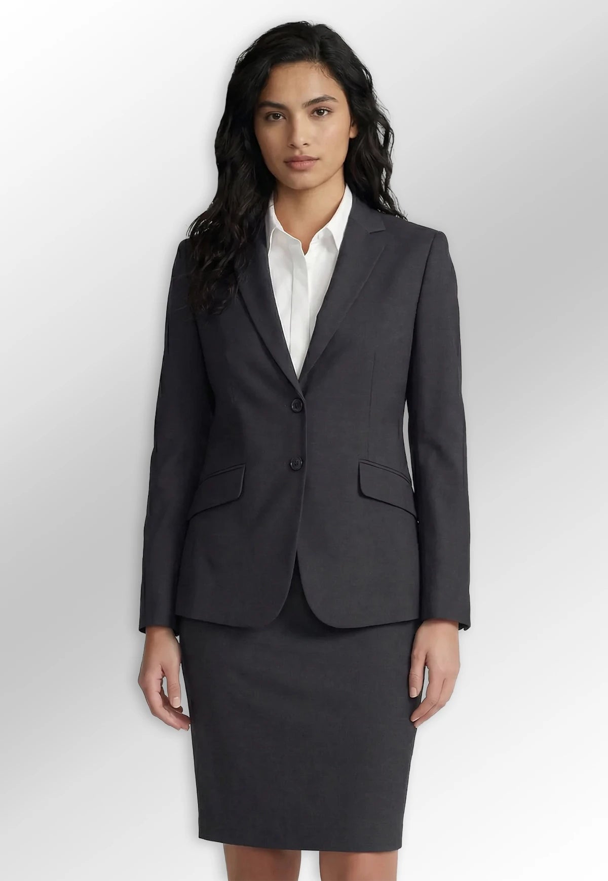 Model wearing the Hebe Suit Jacket & Sigma Straight Skirt in Charcoal Grey from the Brook Taverner Concept Womenswear Collection.