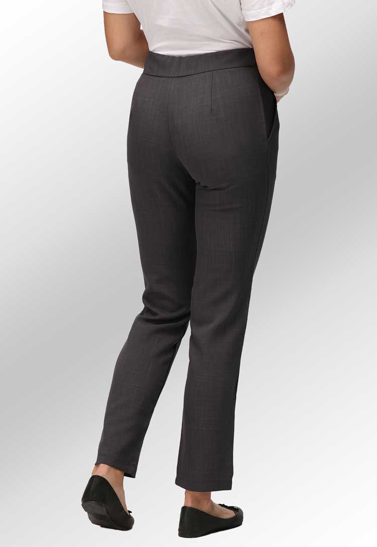 Back View of Model Wearing Ila Slim Leg Salon Trousers in Grey