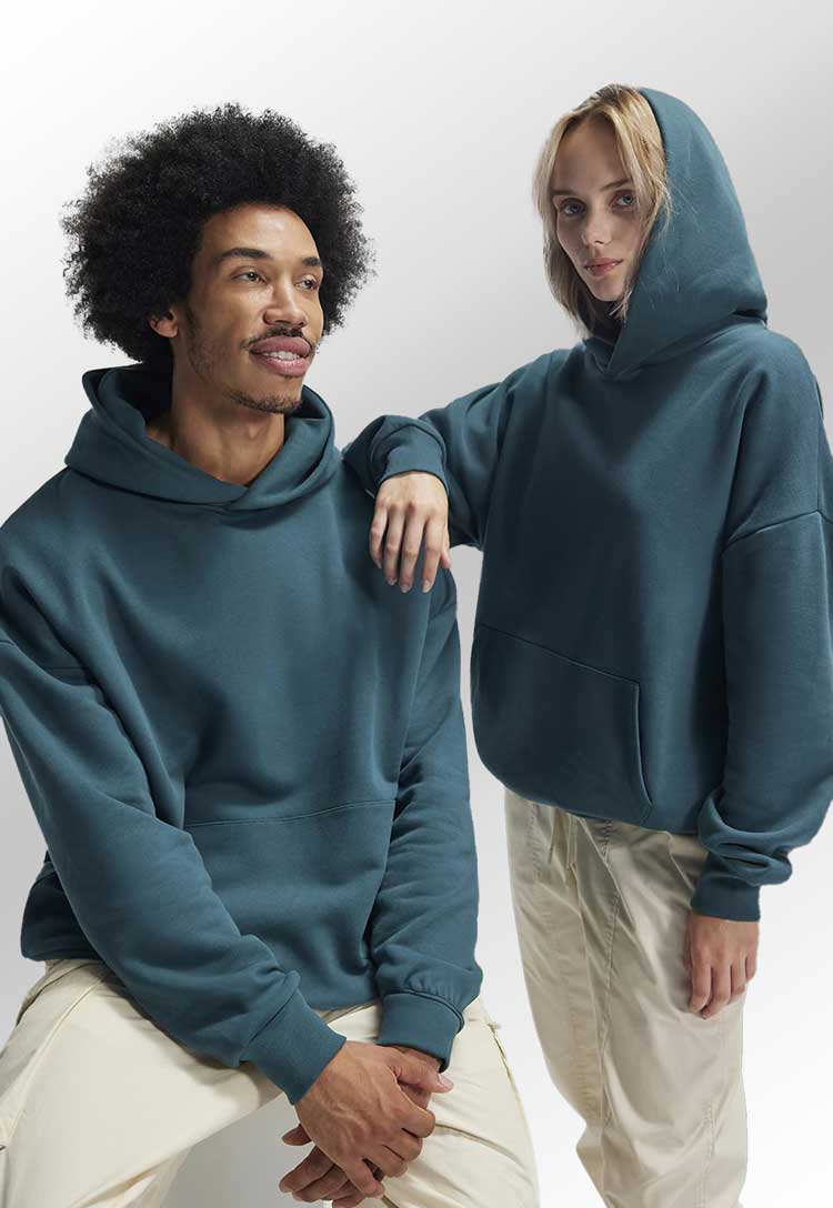 models wearing teal B&C Influence Hoodie BA034