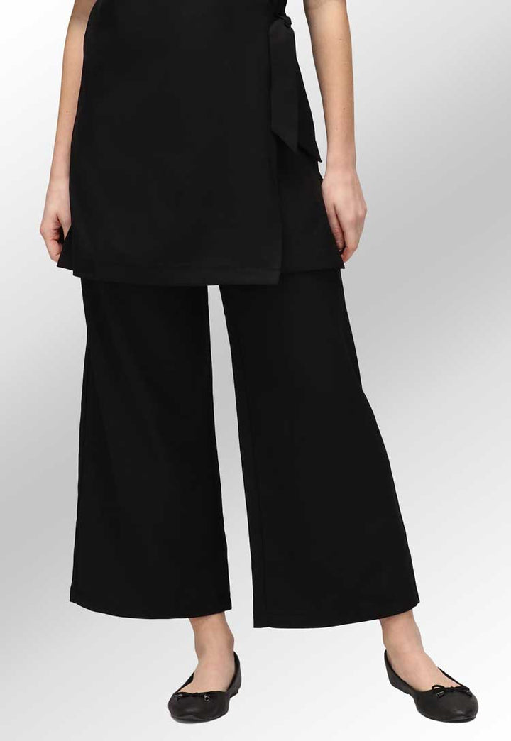 Model Wearing Ivy Culotte Salon Trousers in Black