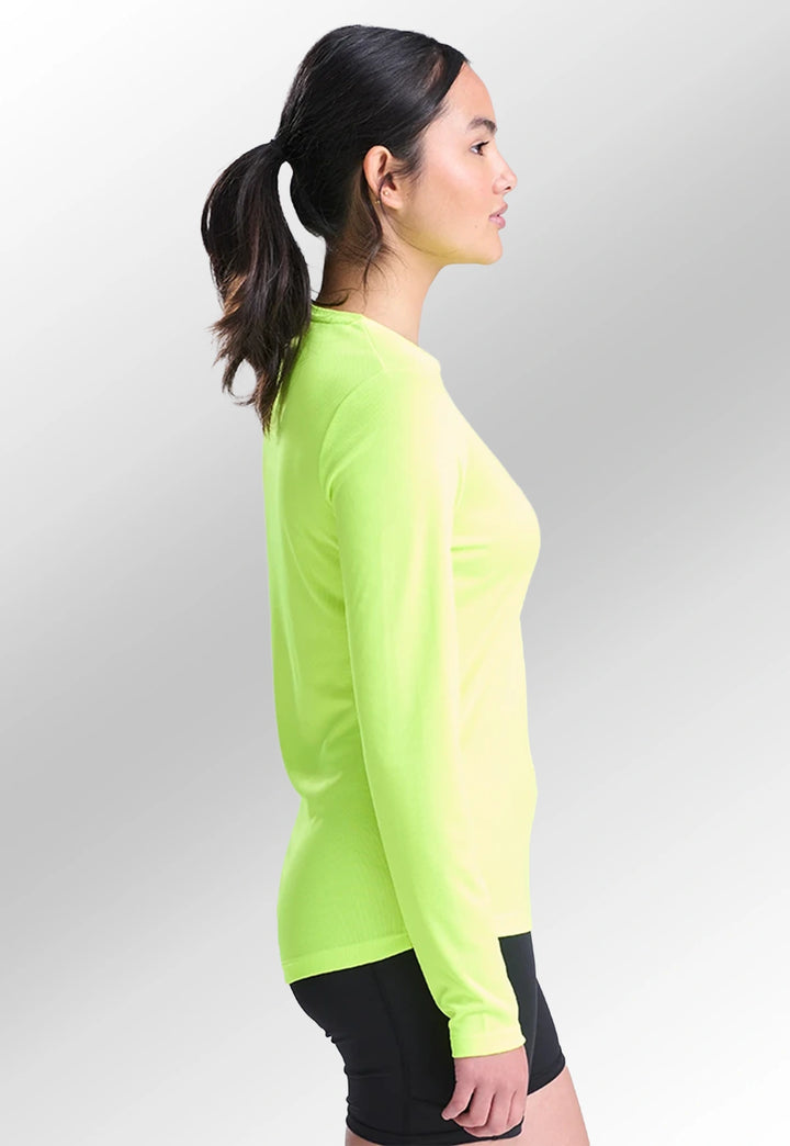 Side view of model wearing the Women's Long Sleeve Cool T-Shirt JC012 in Electric Yellow.