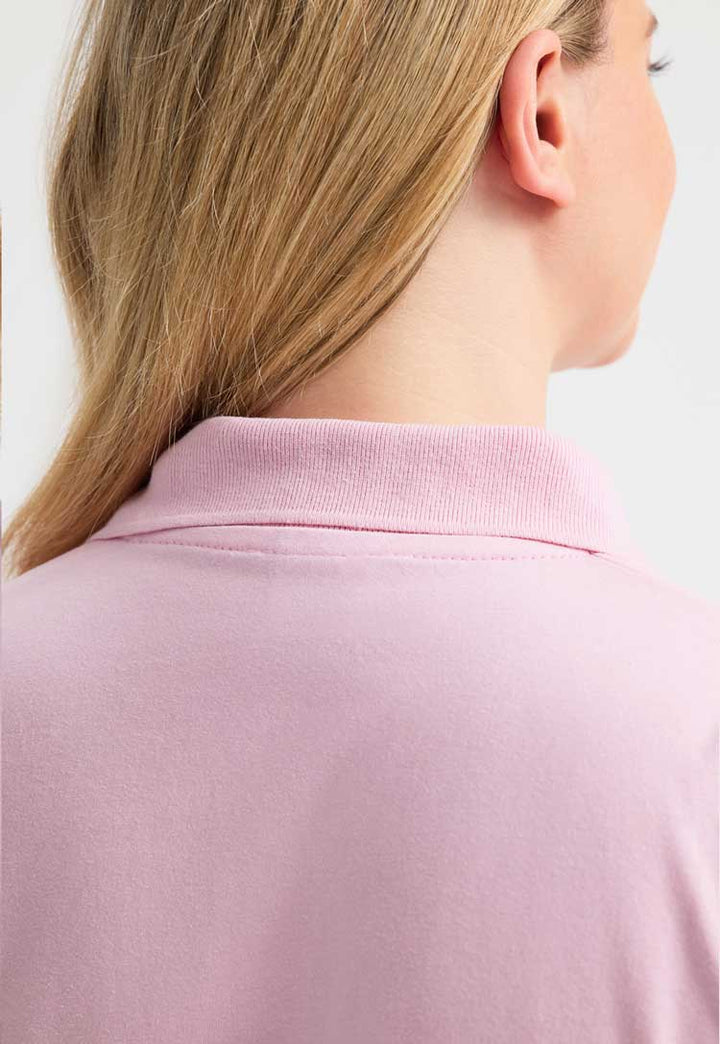 close up back view of model wearing Jersey Polo Shirt  in pink