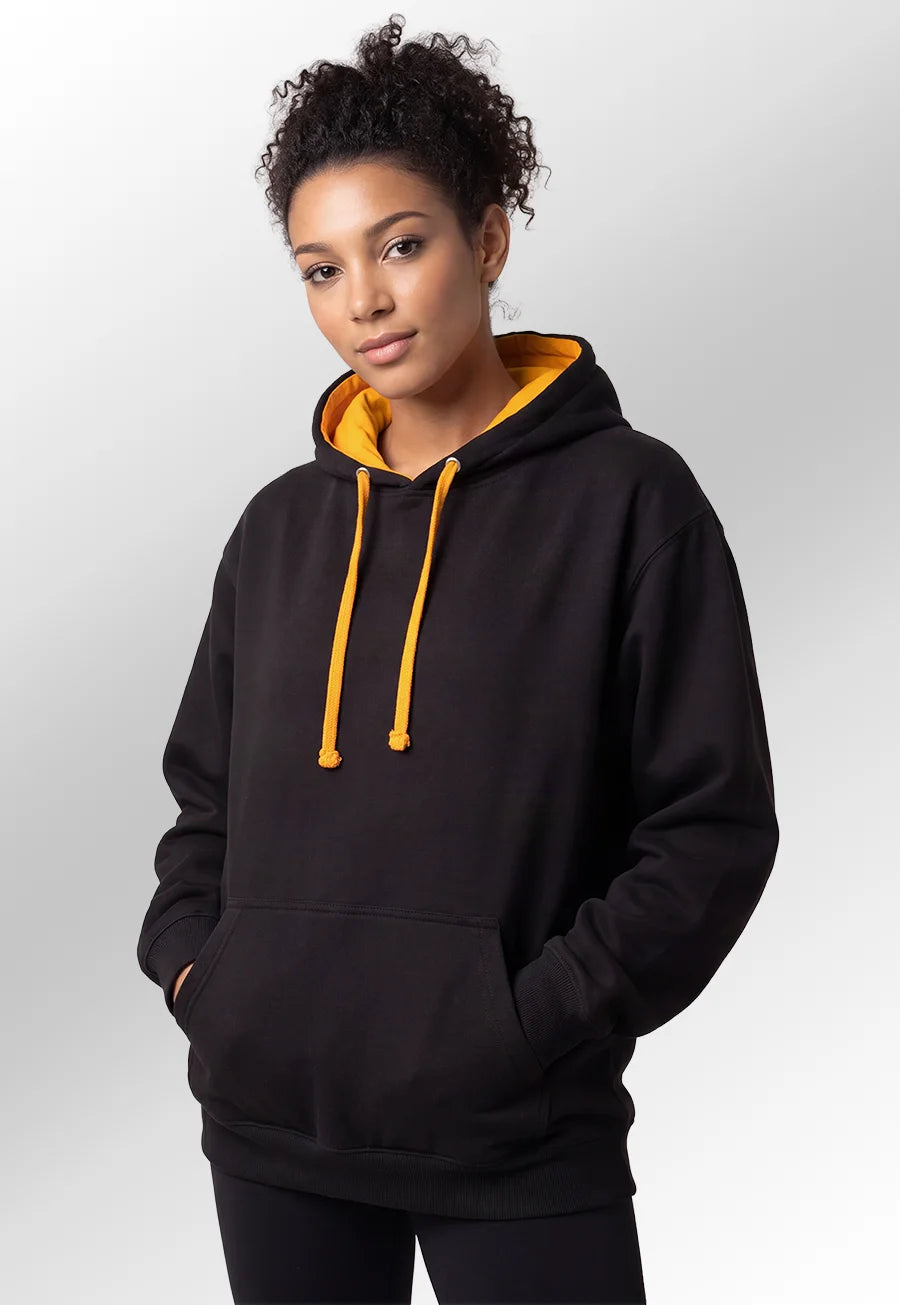 Model wearing the Unisex Black & Orange Varsity Hoodie JH003.