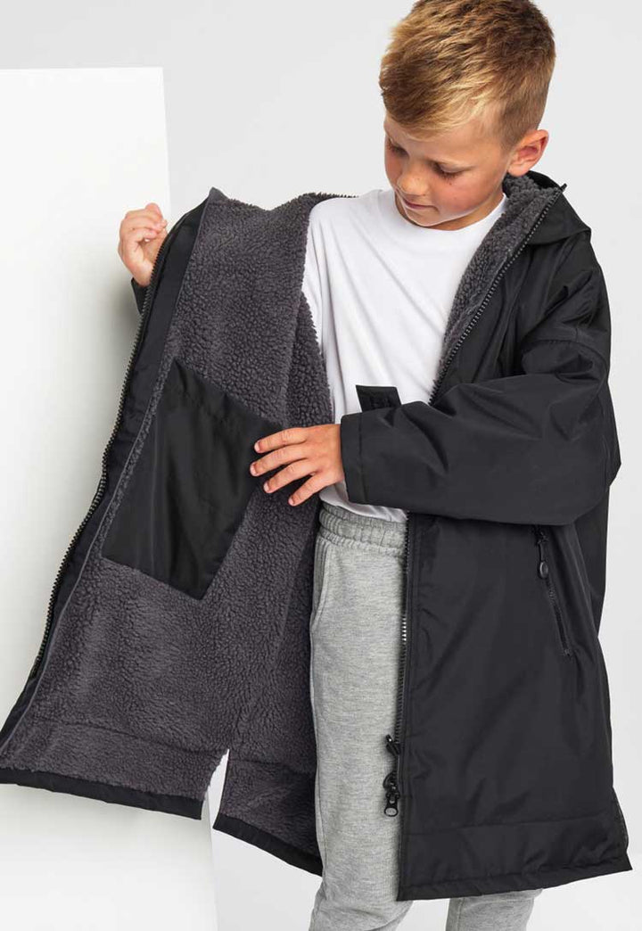 Model showing inside pocket of Kids TriDri® All-Seasons Waterproof Changing Robe TR80B