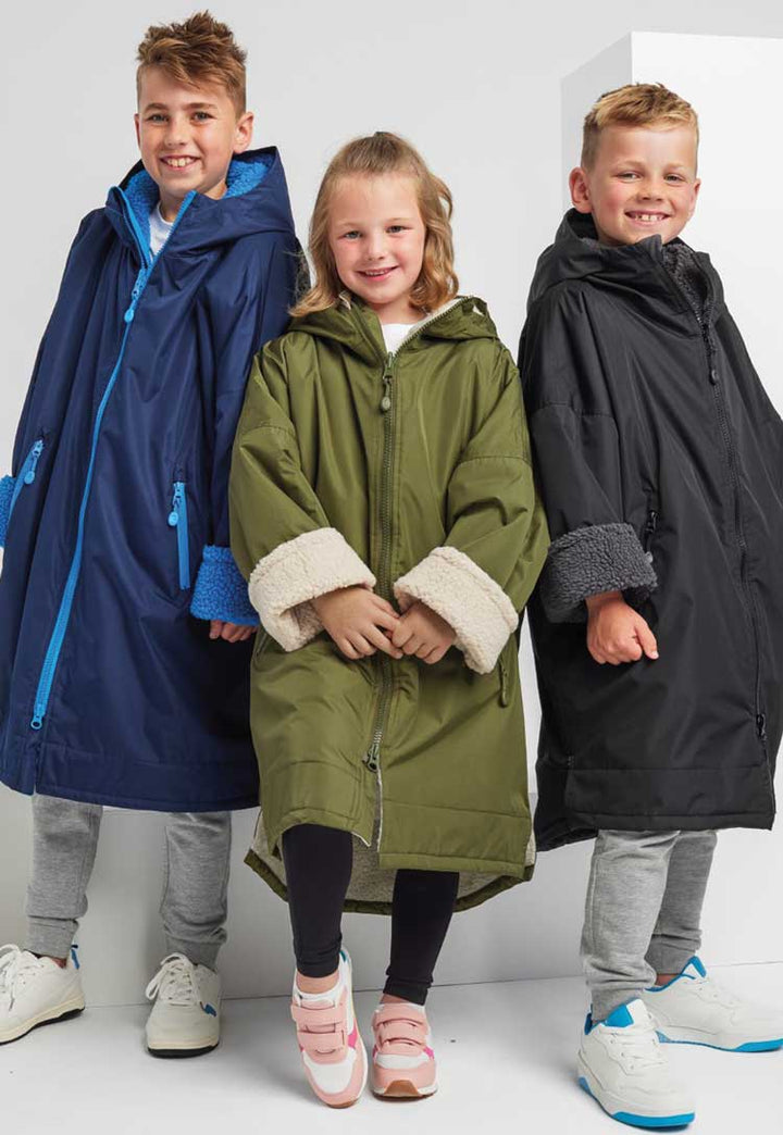 Trio of models wearing Kids TriDri® All-Seasons Waterproof Changing Robe TR80B