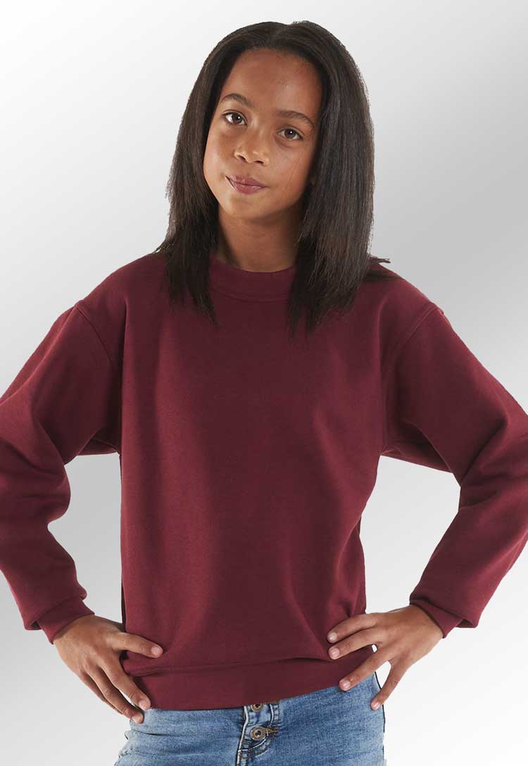 Model wearing Children's Classic Sweatshirt UC202 in maroon