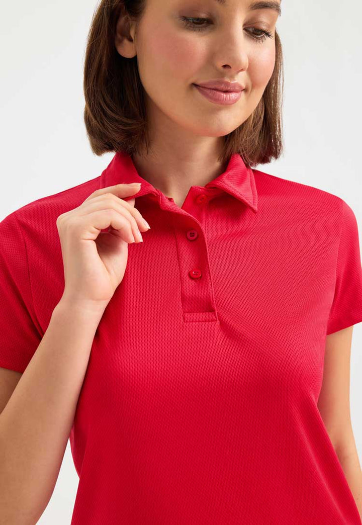 close up of model wearing Ladies Ultra Cool Polo Shirt in red