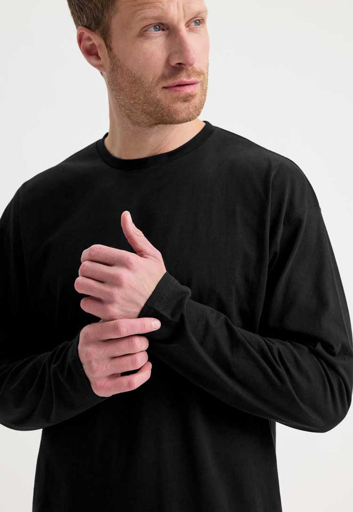 close up model wearing Long Sleeve T-Shirt in black