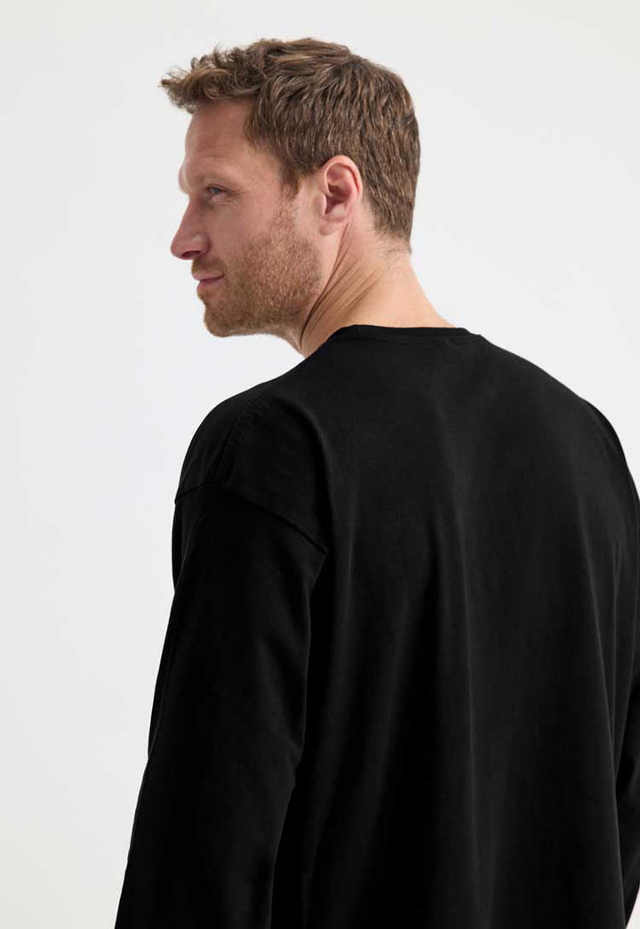 close up back view of model wearing Long Sleeve T-Shirt in black