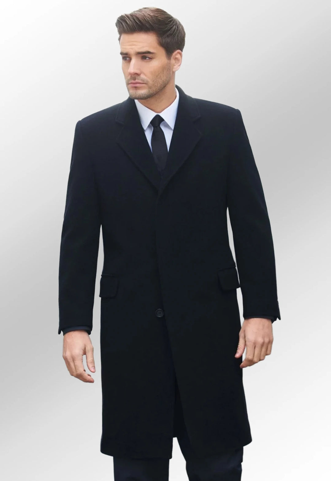 Model wearing the Men's Bond Overcoat in black - The Work Uniform Company
