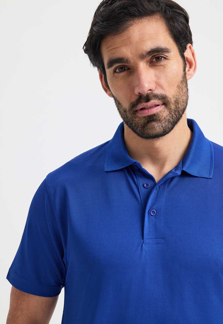 close up of model wearing Men's Super Cool Workwear Polo Shirt in royal blue