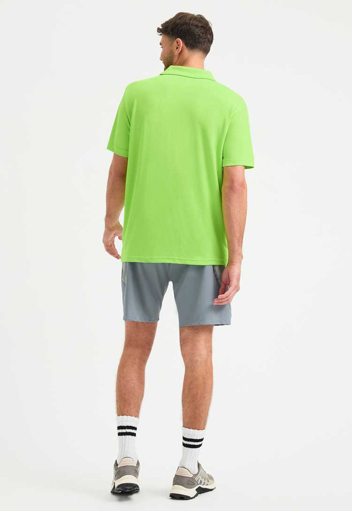 full length back view of model wearing Men's Ultra Cool Polo Shirt in electric green