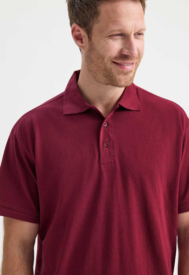 close up of model wearing Men's Ultra Cotton Polo Shirt in maroon