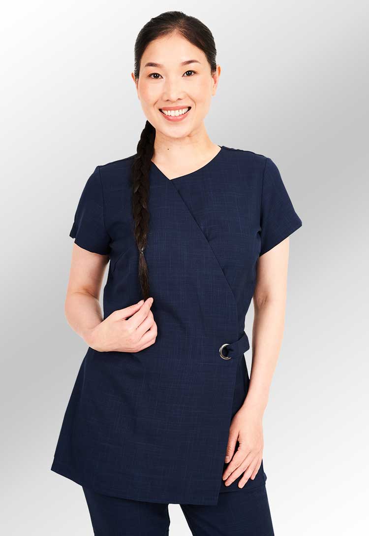 Model Wearing Mila Adjustable Wrap Over Beauty Tunic in Light Navy