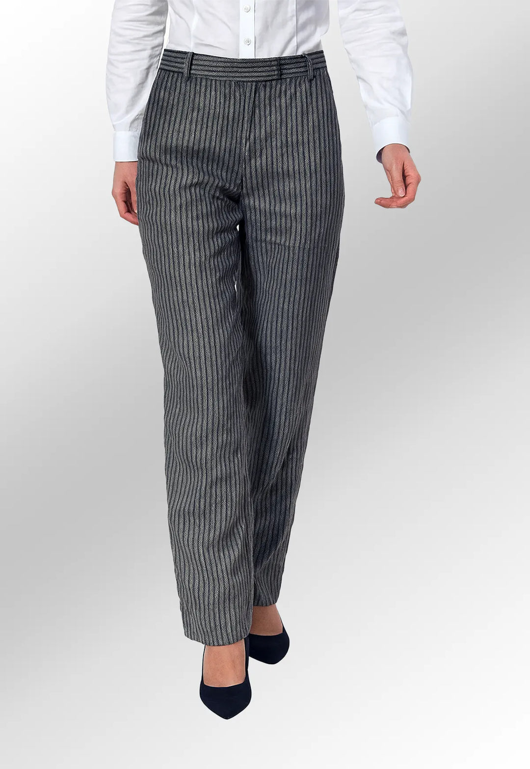 Person wearing gray pinstripe pants and a white shirt on a white background