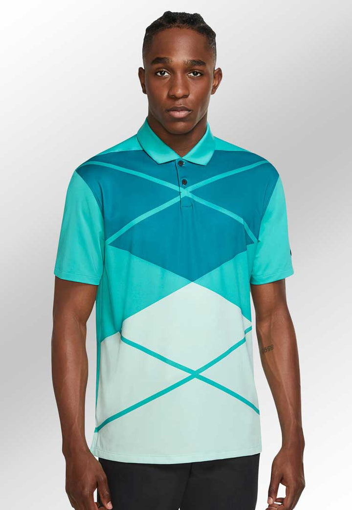 Model wearing Nike Vapor Argyle Print Polo NK338 in teal