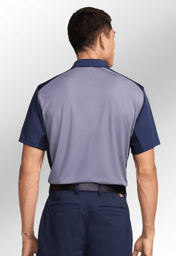 Model wearing Nike Victory+ Polo BL NK170 rear view